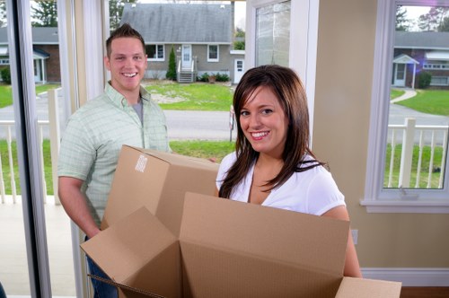 Moving boxes and furniture prepared for a Kennington home relocation