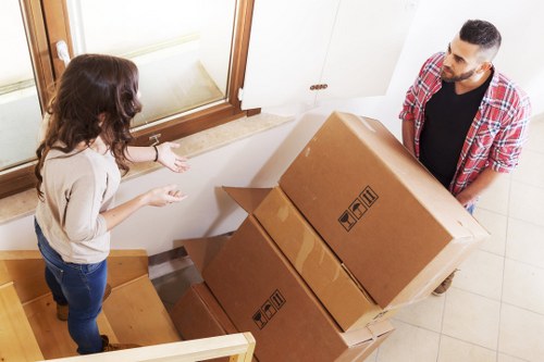 Removal team using protective equipment during a safe home move