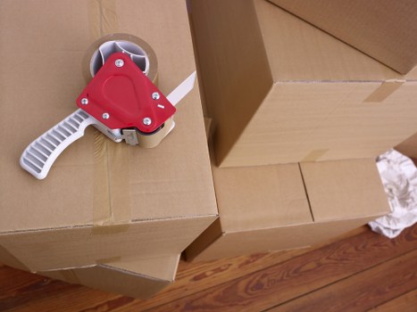 Unpacking boxes in a Kennington flat to help a customer settle in