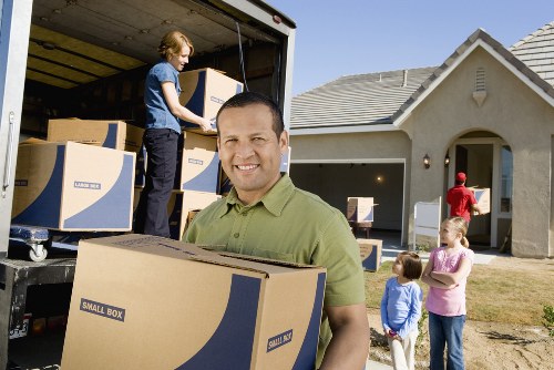 Removal van and packed household furniture ready for transport