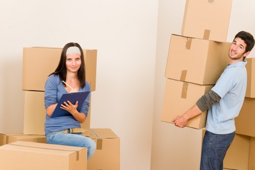 Furniture and boxes being loaded into a moving van